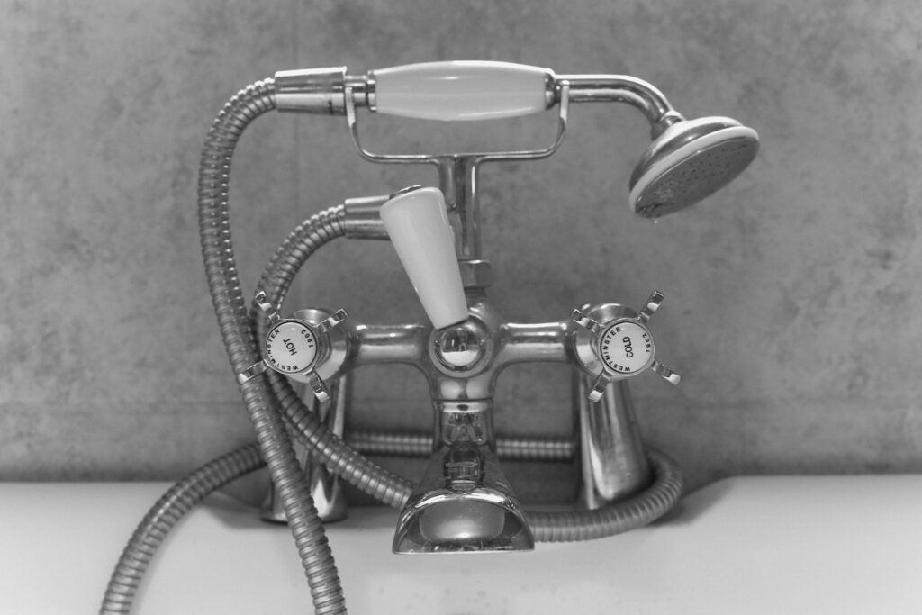 a faucet that is connected to a sink faucet