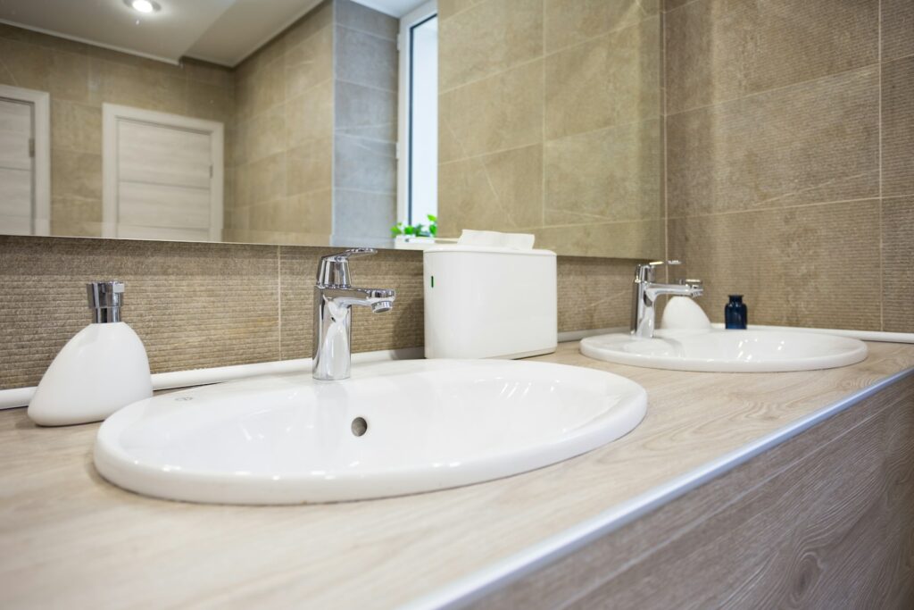 white ceramic sink with faucet